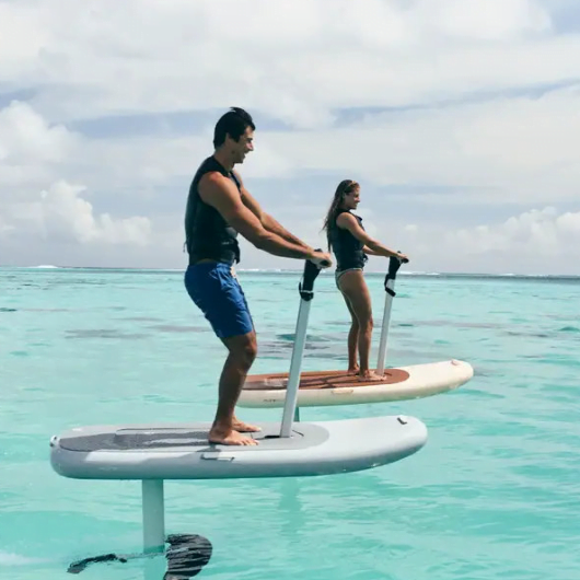 man and woman gliding on Fliteboard over Sarasota Bay